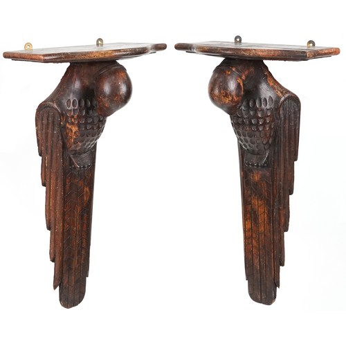 573 - Pair of Arts & Crafts carved walnut wall brackets in the form of birds, 65cm H x 34cm W x 23cm D