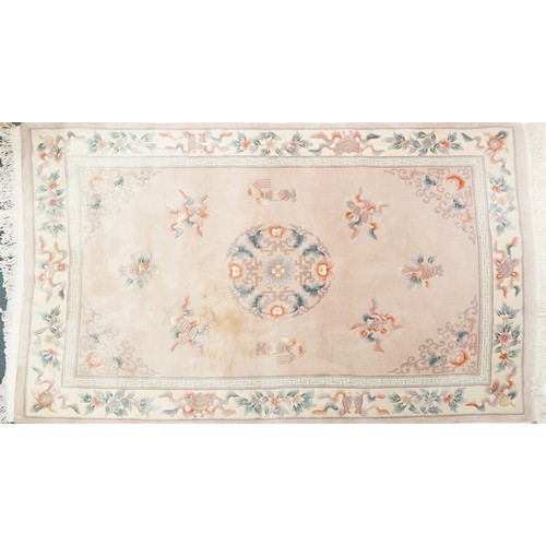 747 - Chinese carpet, late 20th century, the cream field surrounded by a floral border