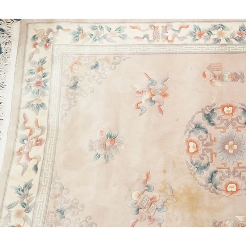 747 - Chinese carpet, late 20th century, the cream field surrounded by a floral border