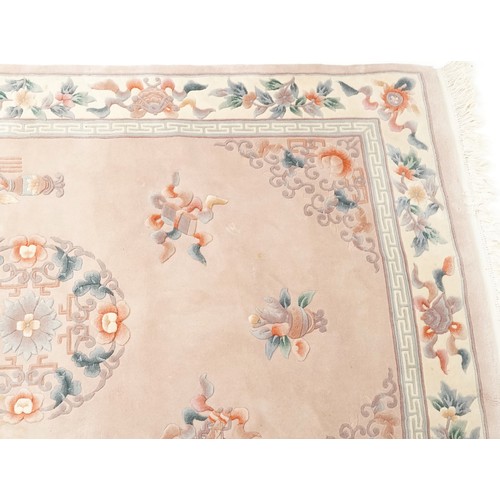 747 - Chinese carpet, late 20th century, the cream field surrounded by a floral border