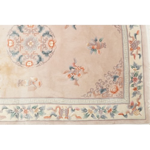 747 - Chinese carpet, late 20th century, the cream field surrounded by a floral border