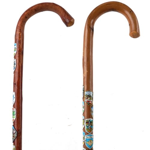 1429 - Swiss bentwood walking stick and a similar British example, each with applied shields including Inte... 