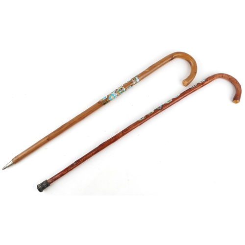 1429 - Swiss bentwood walking stick and a similar British example, each with applied shields including Inte... 