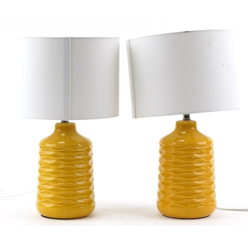 1126 - Pair of modern orange ceramic bedside table lamps with white shades