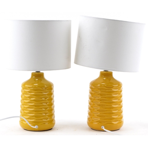 1126 - Pair of modern orange ceramic bedside table lamps with white shades