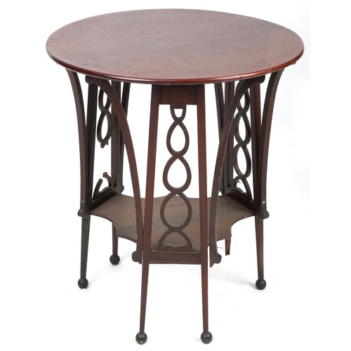 722 - Early 20th century Arts & Crafts style mahogany circular lamp table with pierced fretwork sides, 68c... 