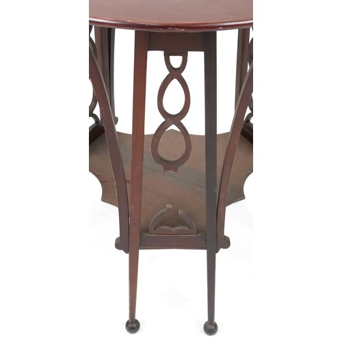 722 - Early 20th century Arts & Crafts style mahogany circular lamp table with pierced fretwork sides, 68c... 