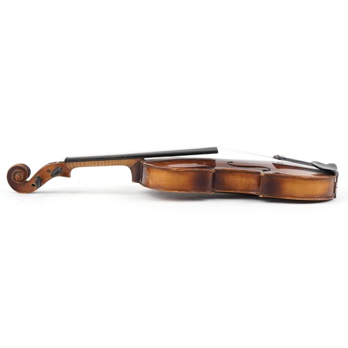 1433 - Old wooden violin and bow bearing a Stradivarius paper label to the interior, the violin back 16 1/4... 