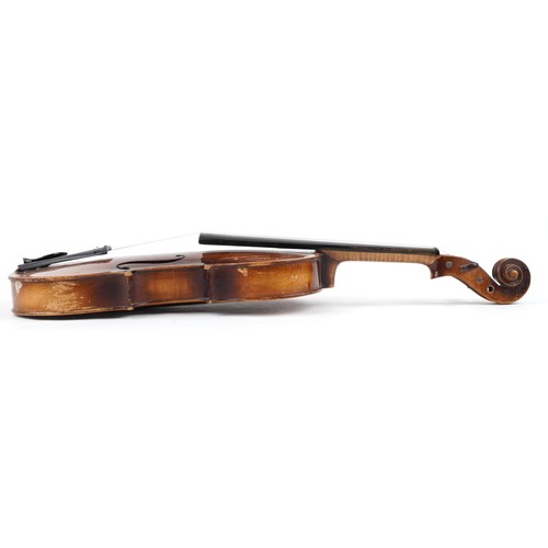 1433 - Old wooden violin and bow bearing a Stradivarius paper label to the interior, the violin back 16 1/4... 