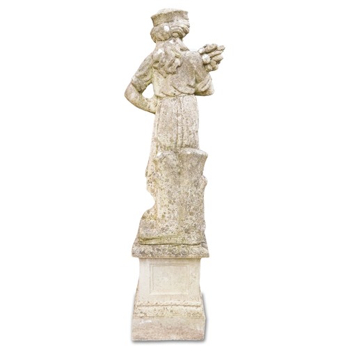 768 - 20th century cast composition stone garden figure of a woman holding wheat sheaf, on a plinth base, ... 