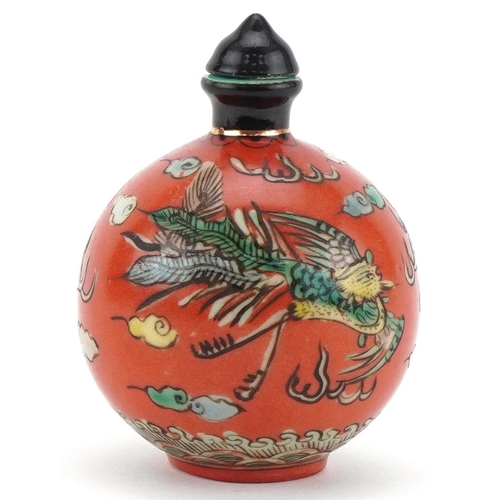 102 - Chinese porcelain scent bottle with stopper hand painted with a dragon and phoenix amongst clouds, f... 