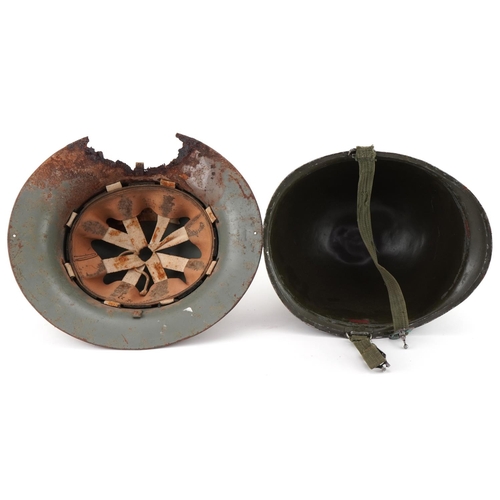 2639 - Two military interest tin helmets, one with German decal