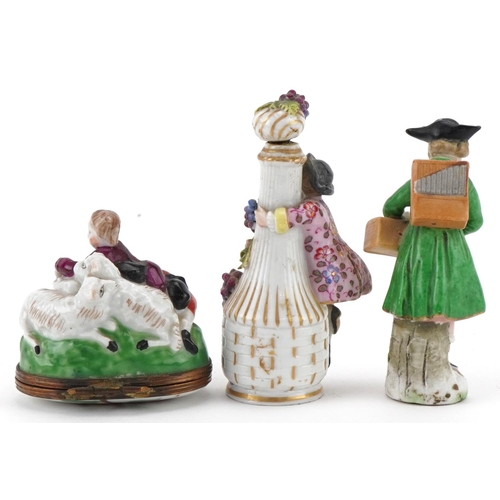 120 - 19th century continental porcelain scent bottle together with a similar figure and a pill box, 8cm h... 