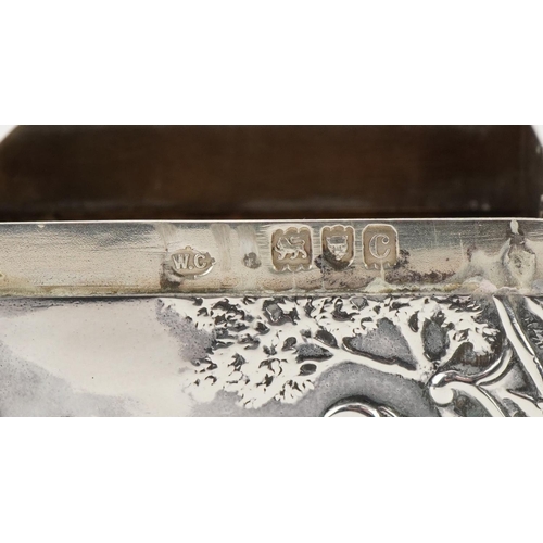 402 - William Comyns, Victorian silver card box embossed with a courting couple before a castle on a hill,... 