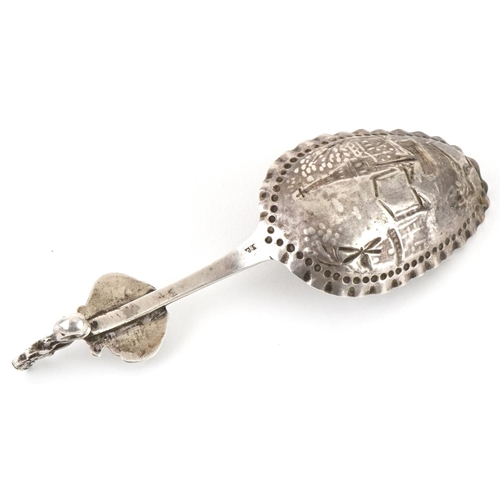 449 - Continental silver preserve spoon embossed with a fisherman before a windmill, possibly Dutch, indis... 