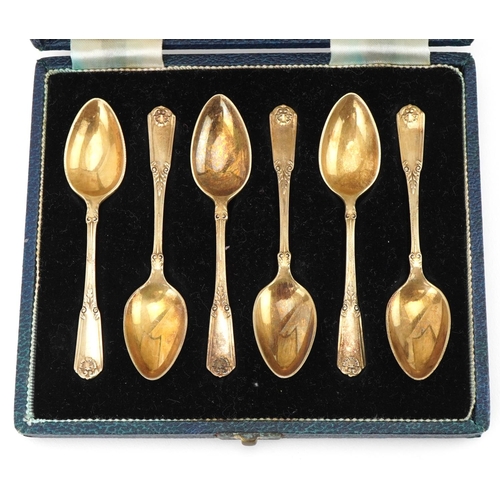 446 - Mappin & Webb, set of six Elizabeth II silver gilt teaspoons housed in a velvet and silk lined fitte... 