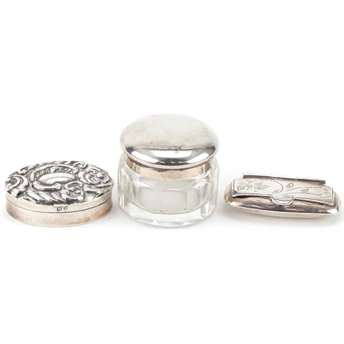 440 - Two silver pillboxes and a glass jar with silver lid, the largest 3.8cm wide, total weight 41.0g