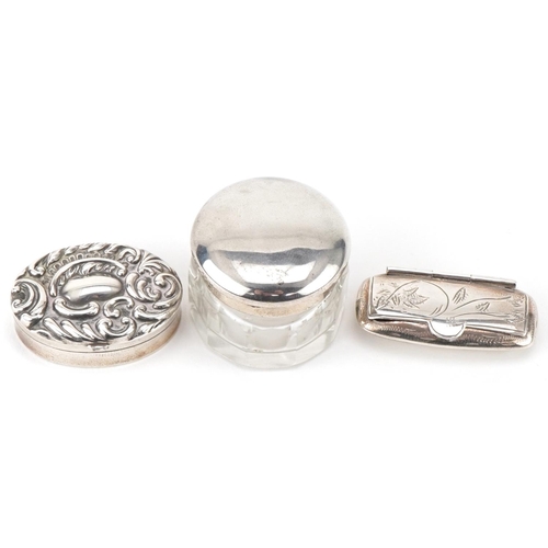 440 - Two silver pillboxes and a glass jar with silver lid, the largest 3.8cm wide, total weight 41.0g