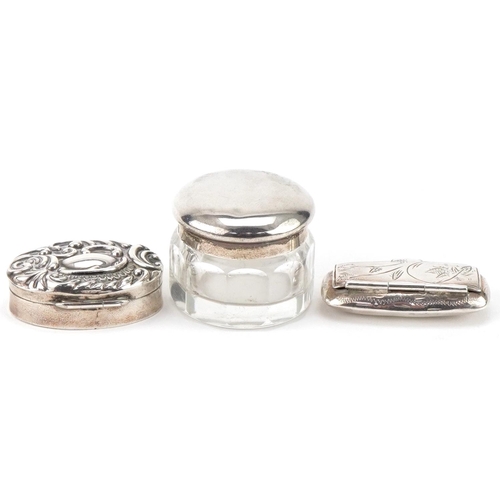 440 - Two silver pillboxes and a glass jar with silver lid, the largest 3.8cm wide, total weight 41.0g