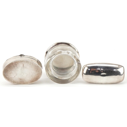 440 - Two silver pillboxes and a glass jar with silver lid, the largest 3.8cm wide, total weight 41.0g