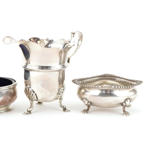 424 - George V and later silver including a pair of open salts with blue glass liners retailed by The Gold... 