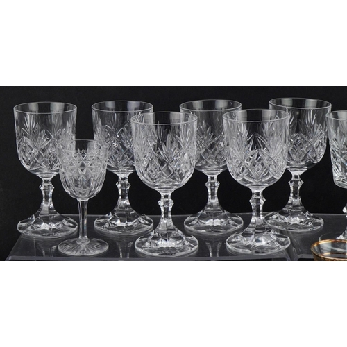 1194 - Two similar cut glass decanters together with a collection of wine and brandy glasses