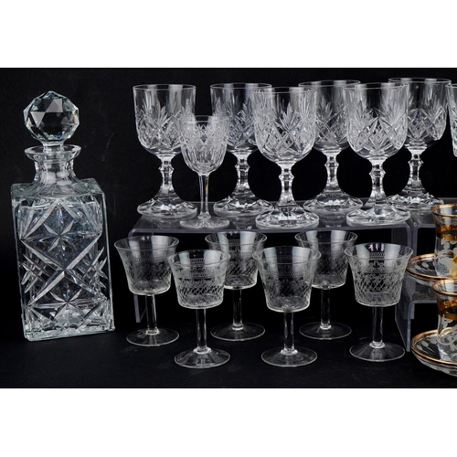 1194 - Two similar cut glass decanters together with a collection of wine and brandy glasses