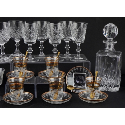 1194 - Two similar cut glass decanters together with a collection of wine and brandy glasses