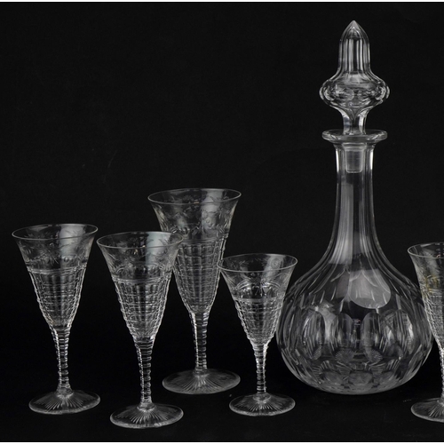 614 - Pair of cut glass decanters together with a small collection of wine glasses