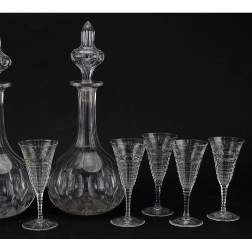 614 - Pair of cut glass decanters together with a small collection of wine glasses