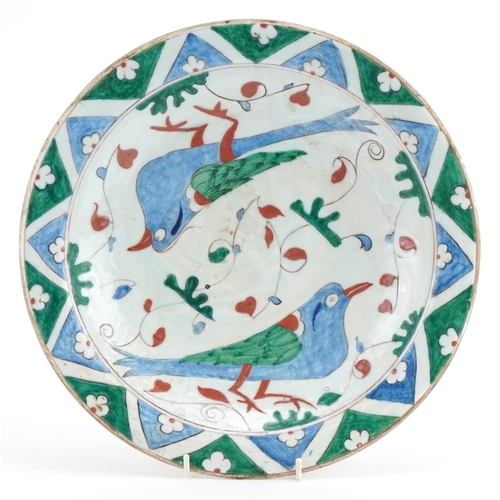 201 - Turkish Iznik pottery plate hand painted with birds and stylised flowers, 31cm in diameter