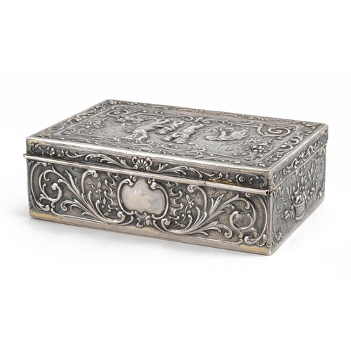 408 - Rectangular Dutch 930 grade silver casket with hinged lid embossed with figures and a dog amongst fl... 