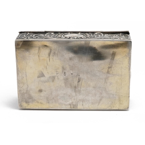 408 - Rectangular Dutch 930 grade silver casket with hinged lid embossed with figures and a dog amongst fl... 