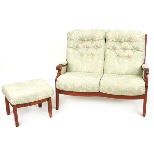 674A - Mahogany framed two seater settee and footstool with green floral upholstery, 118cm wide