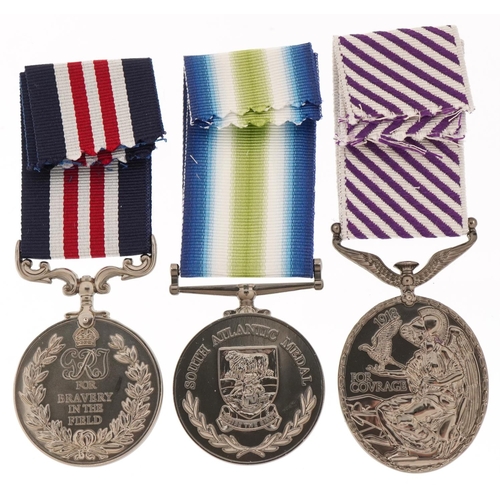 2611 - Three decorative military interest medals with ribbons