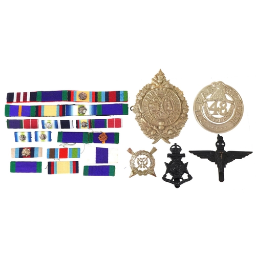 2553 - Collection of decorative military interest cap badges and medal bars