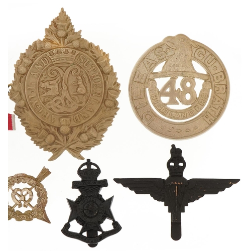 2553 - Collection of decorative military interest cap badges and medal bars