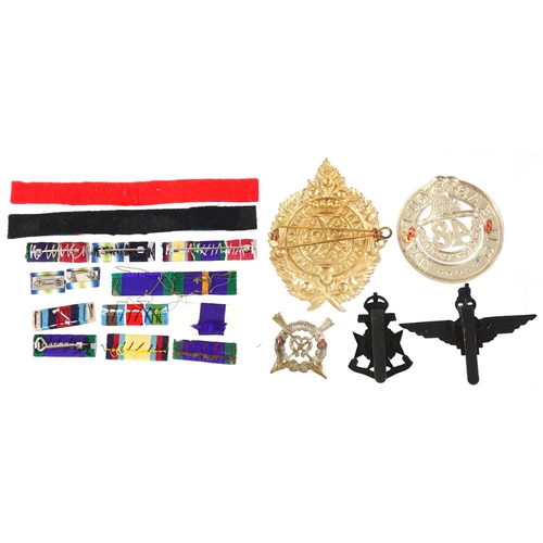 2553 - Collection of decorative military interest cap badges and medal bars