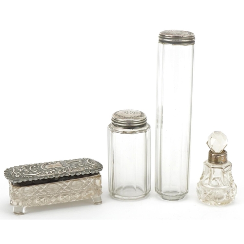 469 - Four Victorian and later cut glass jars with silver lids and a silver dish mounted with a white meta... 