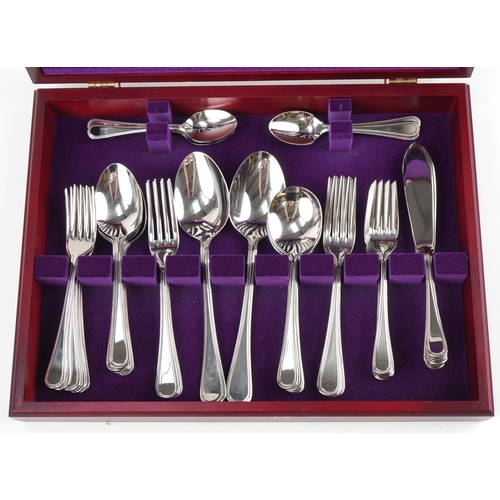 535 - Arthur Price International six place canteen of stainless steel cutlery, 40cm wide