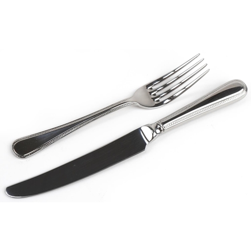 535 - Arthur Price International six place canteen of stainless steel cutlery, 40cm wide