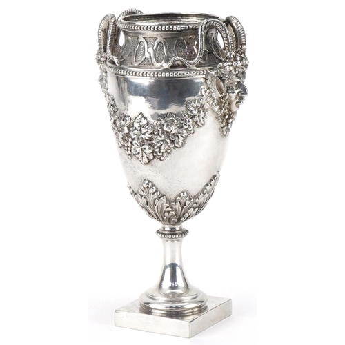 405 - German Hanau silver vase relief decorated with devil heads and embossed with fruit and vines, 16cm h... 