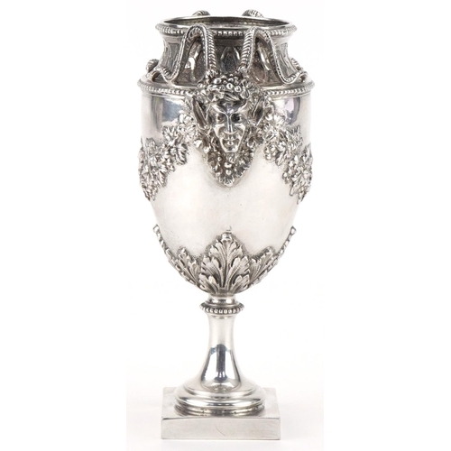 405 - German Hanau silver vase relief decorated with devil heads and embossed with fruit and vines, 16cm h... 