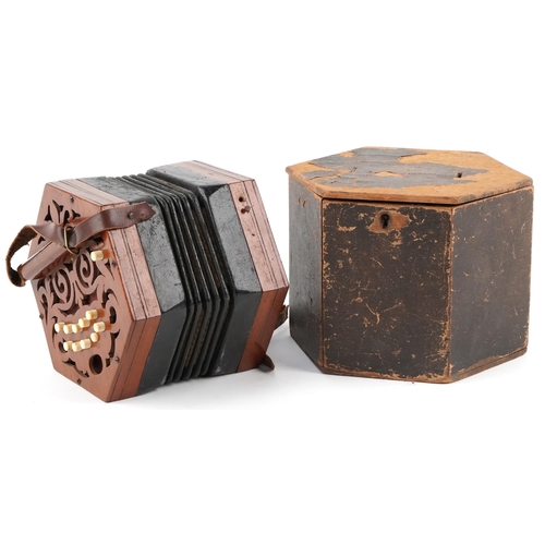 616 - Late Victorian twenty one button concertina by G. Jones, London, the pierced fretwork mahogany ends ... 