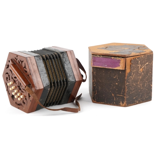 616 - Late Victorian twenty one button concertina by G. Jones, London, the pierced fretwork mahogany ends ... 