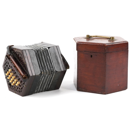 615 - Late Victorian twenty nine button concertina with pierced fretwork ends, with original box, 16cm wid... 