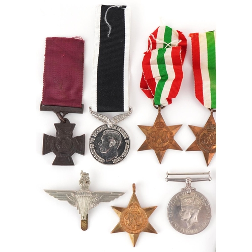 2521 - Militaria including British World War II medals and and RAF cap badge