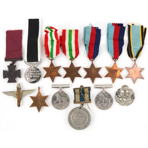 2521 - Militaria including British World War II medals and and RAF cap badge