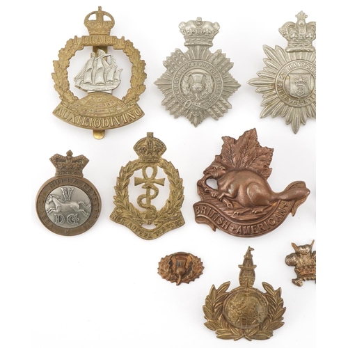 2562 - Twelve military interest cap badges including British American, Duke of Edinburg's Own Volunteer Rif... 