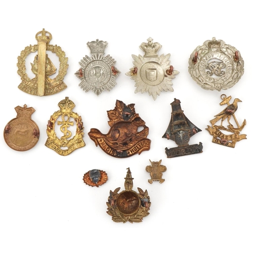 2562 - Twelve military interest cap badges including British American, Duke of Edinburg's Own Volunteer Rif... 